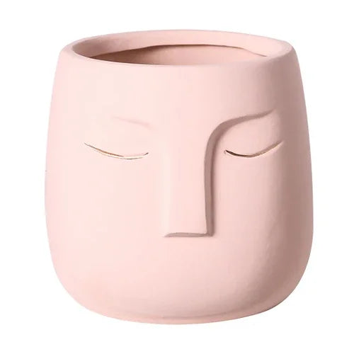 Vaso de cerâmica com rosto